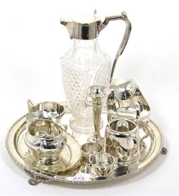 Lot 275 - A silver milk jug; two silver napkins; plated claret jug; and silver and plated wares