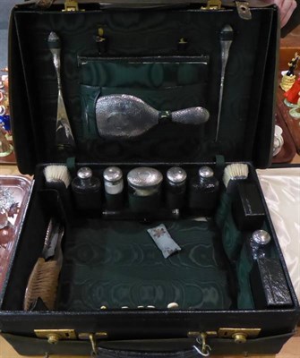 Lot 329 - An Edwardian leather travelling vanity case with silver mounted fittings, the mounts mark of G...