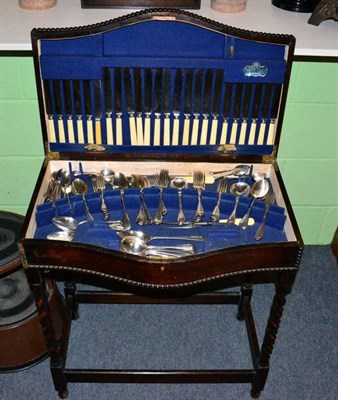 Lot 343 - An early 20th century oak canteen table containing an Elkington & Co plated flatware service