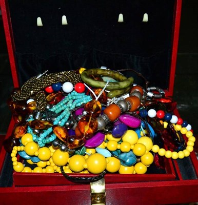 Lot 374 - A quantity of beaded necklaces, including simulated amber and coloured wood bead examples