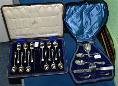 Lot 381 - A set of twelve silver rattail pattern teaspoons with tongs, cased; and a child's silver...