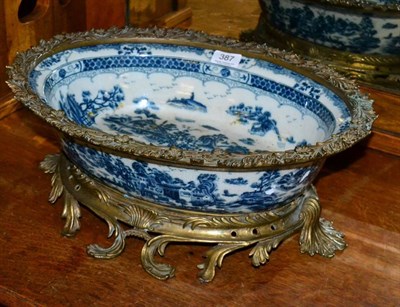 Lot 387 - A large modern gilt metal mounted blue and white porcelain bowl