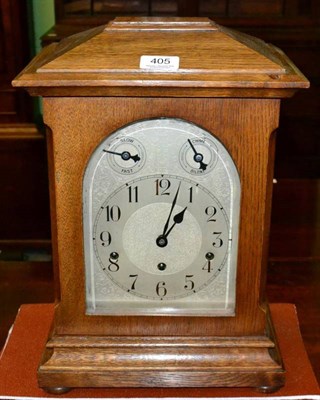 Lot 405 - An oak chiming mantel clock