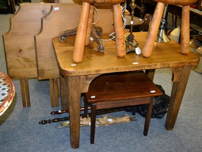 Lot 1113 - A pine side table; two headboards; a low table; warming pans and stair rods