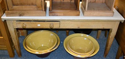 Lot 1116 - A pine farmhouse table with single drawer to one side and later formica top