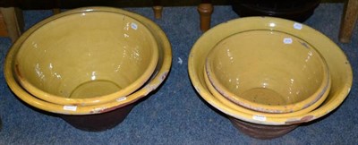 Lot 1117 - Five large yellow slip-glazed earthenware pancheons (5)
