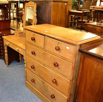 Lot 1133 - A pine four height chest of drawers and a dressing table