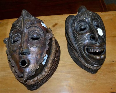 Lot 1133A - Two African brass tribal masks, including a Dan-type example