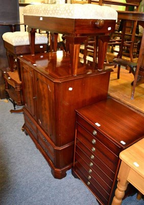 Lot 1134 - A group of reproduction furniture comprising two piano stools; a TV cabinet; a CD cabinet and a...
