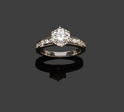 Lot 441 - A Diamond Solitaire Ring, by Tiffany, the round brilliant cut diamond in a tiffany setting measures