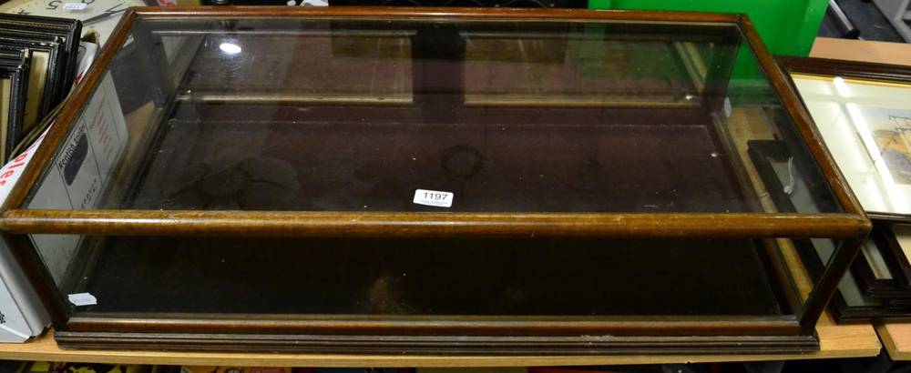 Lot 1197 - A glazed table top display cabinet