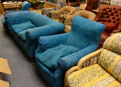 Lot 1203 - An early 20th century drop end sofa and matching pair of armchairs