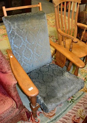 Lot 1206 - An oak armchair with ratcheted back rest