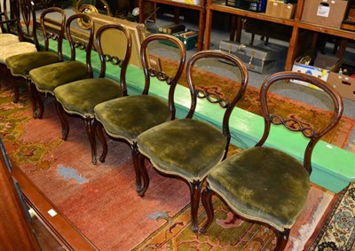 Lot 1211 - A set of six Victorian rosewood balloon back dining chairs