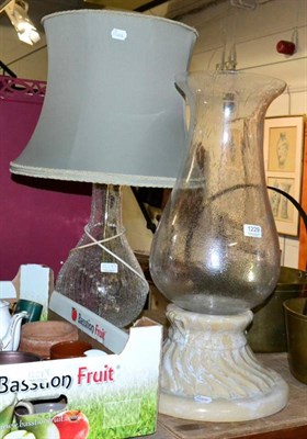 Lot 1229 - Large glass and pottery storm lantern, together with a glass table lamp and shade