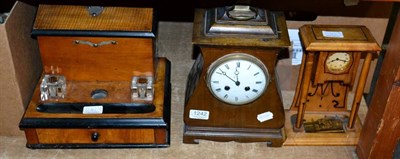 Lot 1242 - An Edwardian mahogany mantel clock and another, and a desk stand (3)