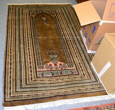 Lot 1259 - Indian Prayer rug, the field with hanging lamp beneath the Mihrab enclosed by multiple borders,...