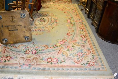 Lot 1262 - Chinese carved carpet, the mint green field with central floral panel enclosed by spandrels and...