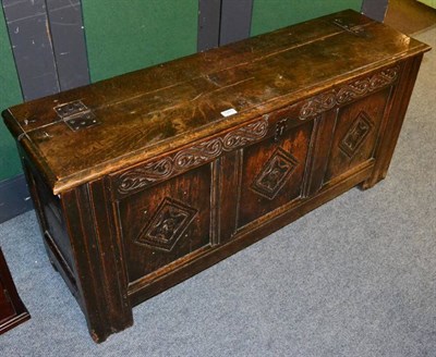 Lot 1265 - A carved oak coffer