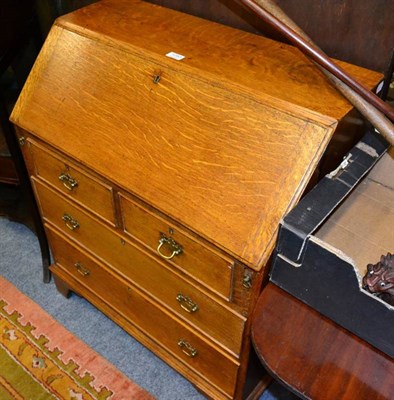 Lot 1283 - An oak writing bureau