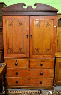 Lot 1337 - A late Regency pine linen press with painted decoration to the doors, the base with short short...