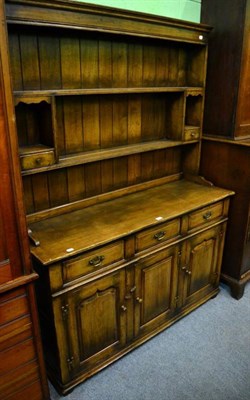 Lot 1341 - A Titchmarsh & Goodwin oak dresser, modern, unmarked, RL19855, the rack with two fixed shelves...