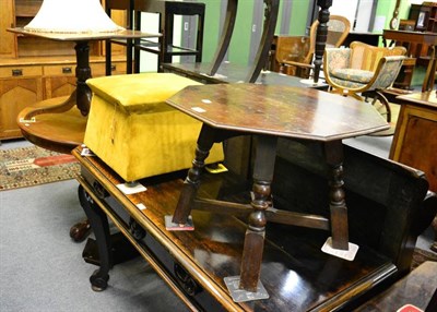 Lot 1355 - An upholstered Ottoman with hinged top, an octagonal oak low table and a tripod table reduced...