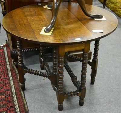 Lot 1362 - An oak bobbin turned gateleg table