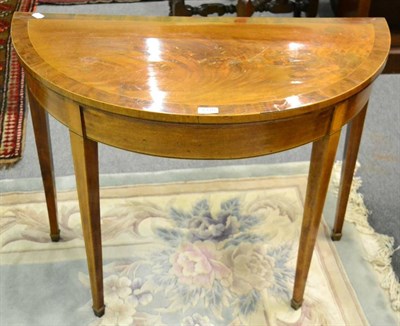 Lot 1370 - A George III mahogany and crossbanded fold over card table