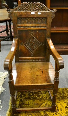 Lot 1371 - An 17th century style joined oak Wainscot type armchair