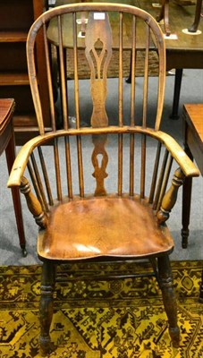 Lot 1373 - A mid 19th century ash high back spindle armchair