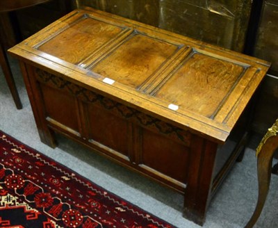 Lot 1379 - An 18th century panelled coffer with hinged lid