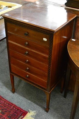 Lot 1381 - A blind fret carved music cabinet