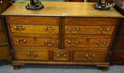 Lot 1384 - An 18th century oak mule chest adapted to a cupboard