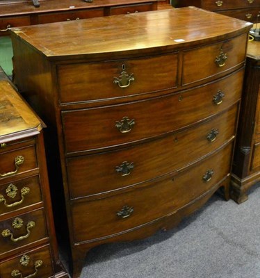 Lot 1385 - An early 19th century mahogany bow fronted four height chest of drawers