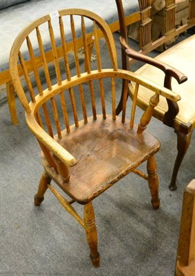 Lot 1391 - A 19th century ash and elm spindle back Windsor armchair, with spindle legs and H stretcher