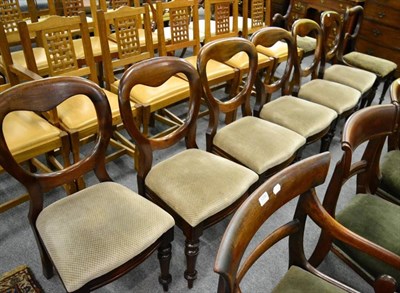 Lot 1395 - A set of six Victorian mahogany balloon back dining chairs; and a pair of Victorian dining...