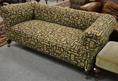 Lot 1400 - A late Victorian Chesterfield sofa, recovered in a geometric patterned fabric