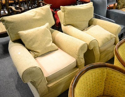 Lot 1403 - A pair of modern cream upholstered armchairs