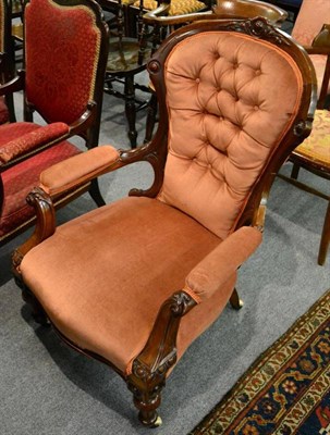 Lot 1407 - A Victorian walnut button back armchair