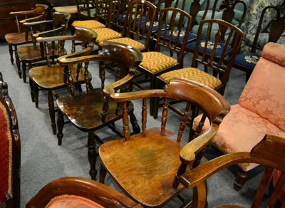 Lot 1408 - A matched set of five smokers chairs