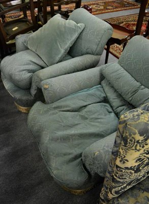 Lot 1414 - A pair of early 20th century Howard style armchairs, upholstered in worn green fabric