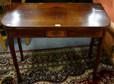 Lot 1415 - A 19th century mahogany satinwood and boxwood strung fold over tea table