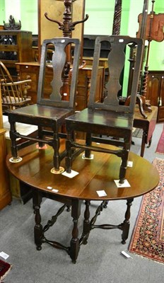 Lot 1431 - An 18th century oak gateleg table and a pair of 18th century chairs with solid splats