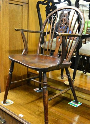 Lot 1437 - A 19th century wheelback Windsor chair