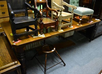 Lot 1448 - A late 19th century oak extending table