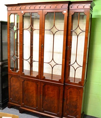 Lot 1465 - A Charles Barr mahogany four door breakfront bookcase, modern