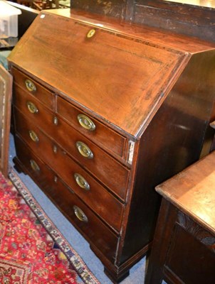 Lot 1478 - A George III oak dresser on ogee bracket feet