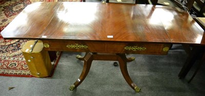 Lot 1481 - A Regency style mahogany and ebony strung sofa table, with gilt metal mounts