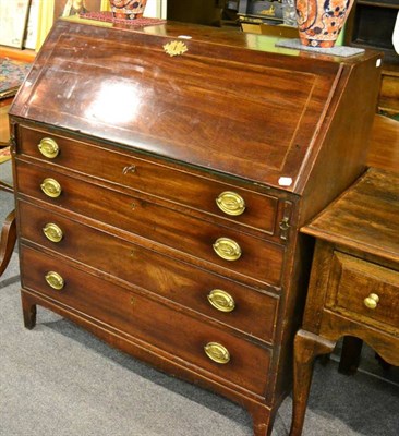 Lot 1485 - An early 19th century mahogany bureau